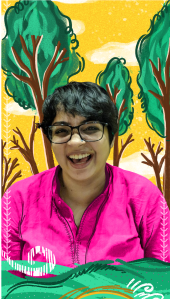 Srinidhi Raghavan is seated against a yellow background with trees. There are waves at the bottom.She has short and black hair. She is wearing a pink kurta, black framed glasses and a nose pin.